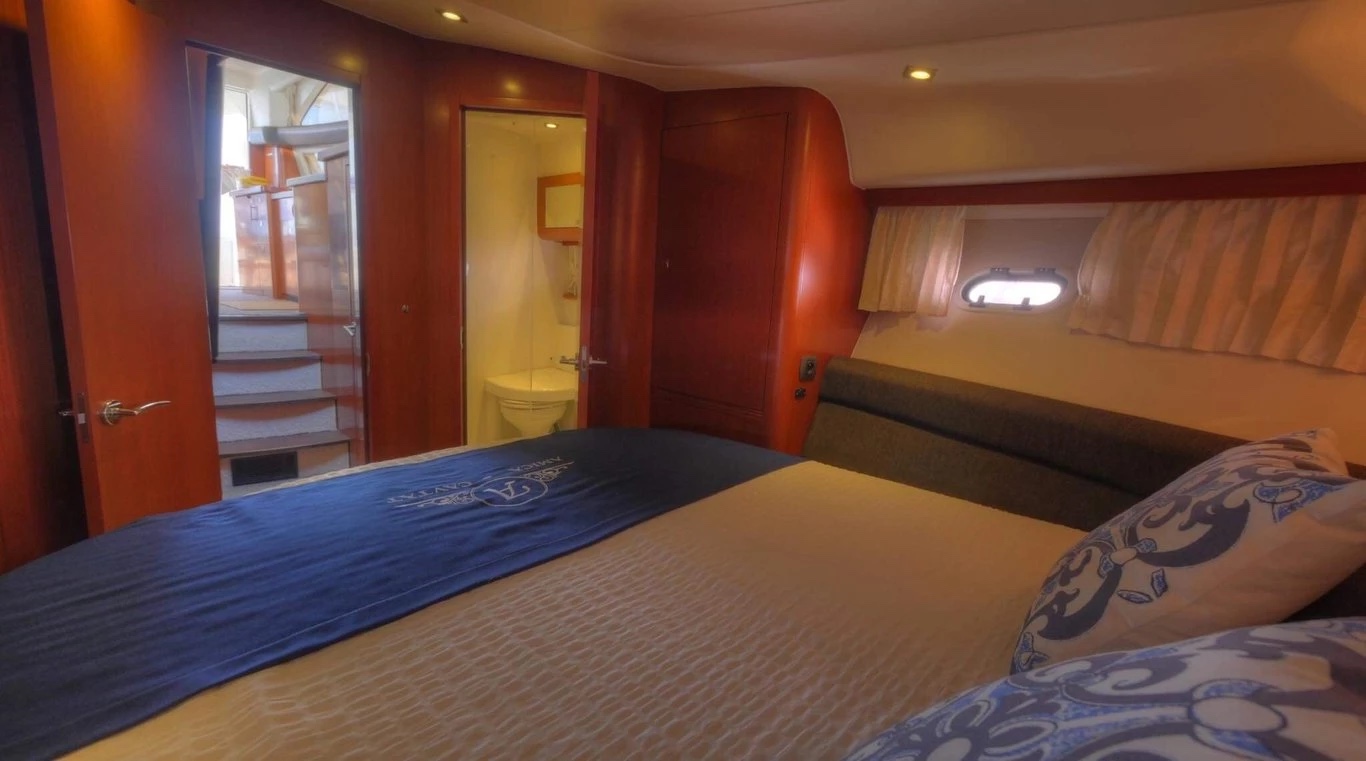 Double cabin aboard the Prestige 440 Fly with en-suite bathroom and steps up to the saloon